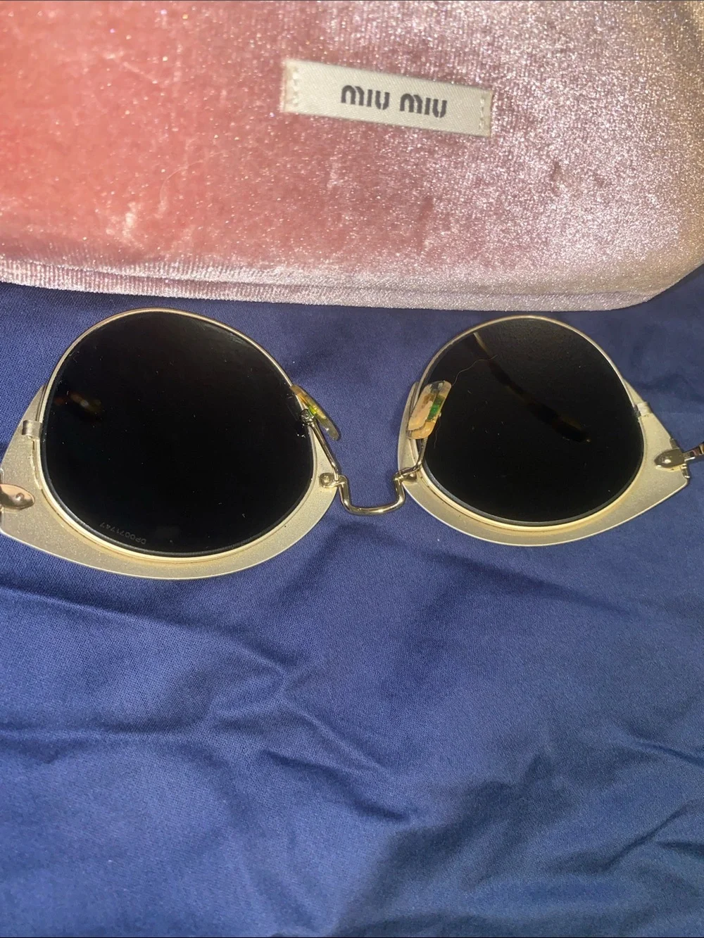Authentic Miu Miu women’s Blue Round Metal-Trim Sunglasses
